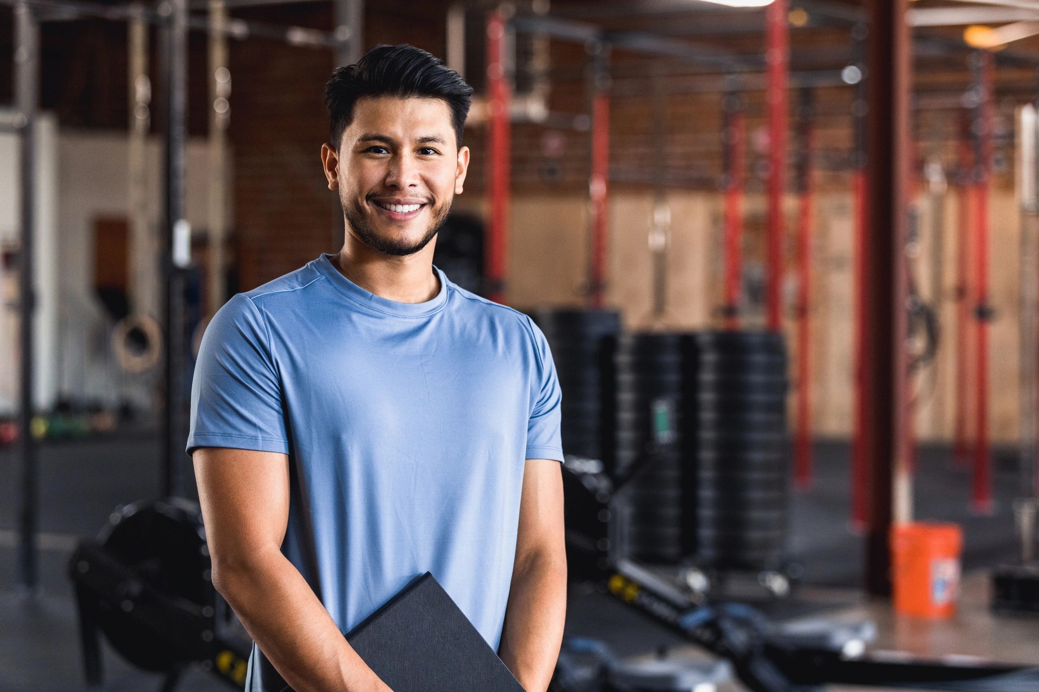 Gym owner holding a clipboard